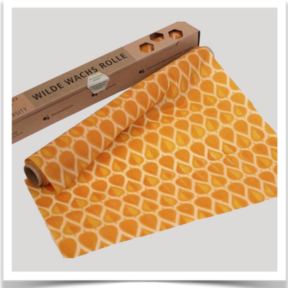 Wild wax wraps roll in orange autumn leaves print at Prairie Road Organic Seed