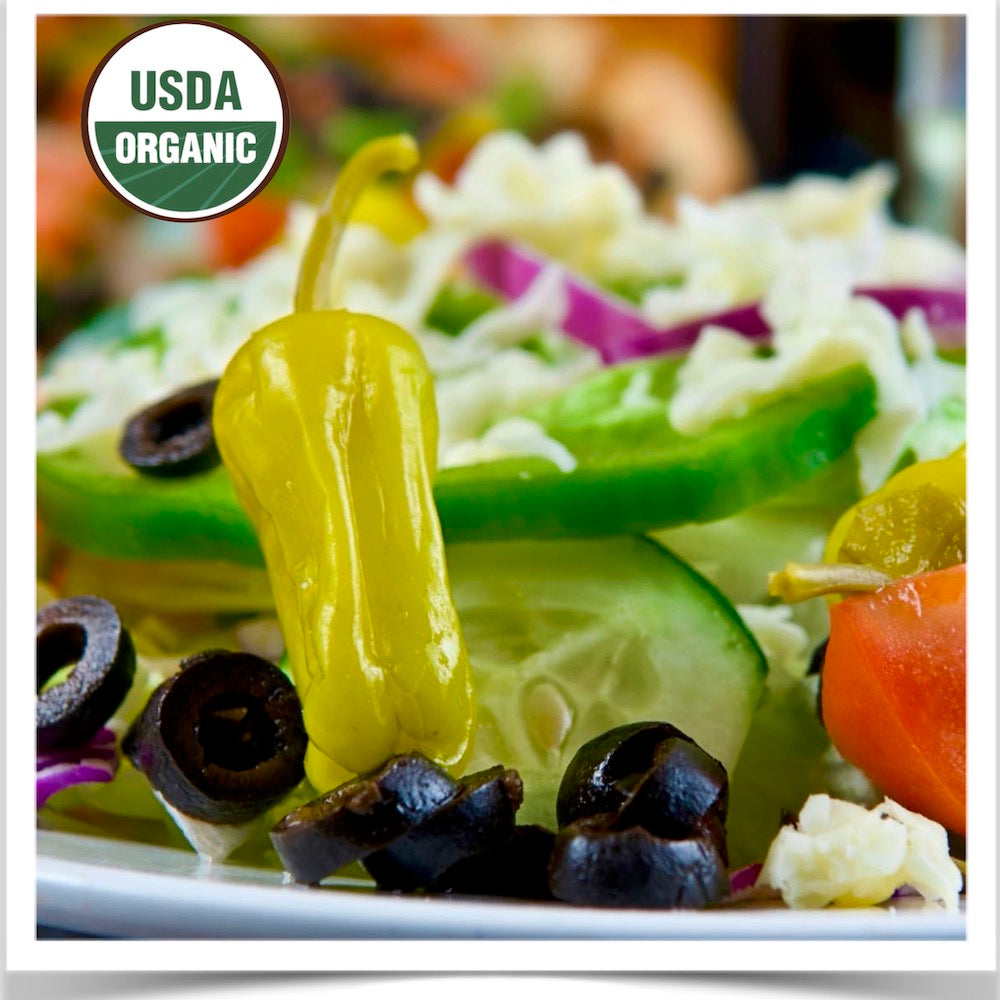 Salad with pickled Pepperoncini peppers grown from certified organic Pepperoncini pepper seed